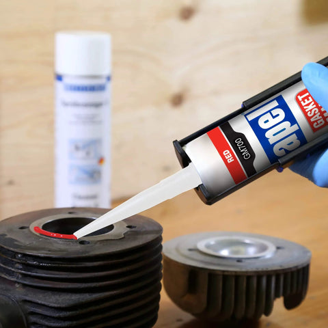 Heavy Duty High Temp RTV Silicone Gasket Maker And Sealant For Auto And Machinery That Handles Serious Heat From 104 Degrees Fahrenheit To 572 Degrees Fahrenheit Red 10.2 Oz Gasket Sealing Adhesive For Engines And Exhaust being applied to machinery