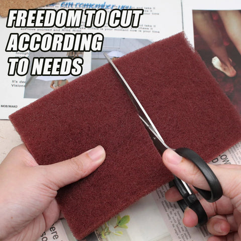 Hands cutting Six Pack Red Scuff Pads Very Fine Grade for Paint Prep and Finishing 8 x 5 Inches with scissors
