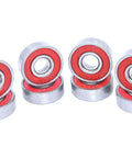 Quiet 608RS Skateboard Bearings Red 100 Pack Low Noise High Precision 8x22x7mm shown in stacks, shiny and red shielded.
