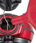 Close-up of Red Ultra Fine Snap Line Chalk 10.5 Ounce Bottle filling nozzle, illustrating precise marking setup for construction.