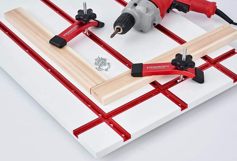 Double Cut Universal T Track Hold Down Clamps 2 Pack For T Slot Workholding Red Anodized With Rubber Pads installed on workbench