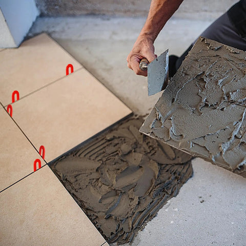 Installation with 100 Piece Tile Spacer Set For Leveling Floors Windows And Toilets Horseshoe Plastic Shims visible in use.