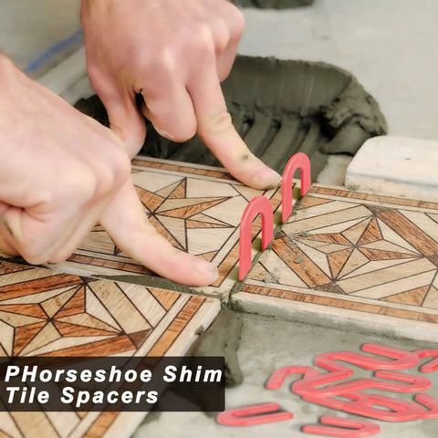 800 Pack U Shaped Tile Spacers For Leveling And Tile Alignment Plastic Structural Shims Set In Four Sizes And Color Codes Black Yellow Red Blue 200 Pieces Per Size For Easy DIY Home Renovation And Quick Precise Tile Spacing being used for tile installation.