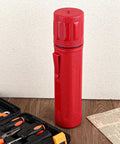 Image of a Red 14 Inch Welding Rod Storage Tube, airproof and waterproof, made of ABS material, next to tools. Part of a two-pack for electrodes.