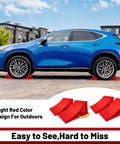 A car parked using Heavy Duty Wheel Chocks For Travel Trailers, HOXWELL Two Pair Non Slip Red Blocks With Rope.