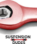 Four Piece Alignment Caster And Camber Kit For GM Trucks And SUVs Restores Factory Specs With Camber Adjustment Plus Or Minus One And A Half Degrees Reducing Tire Wear And Steering Pull Made In USA Anti Corrosion Protected Hardware Fits Tahoe Yukon with wrench close-up on logo.