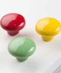 Red Ceramic Knobs Set Of 4 For Cabinets And Drawers Round Colored Drawer Handles For Kitchen Cabinets Dresser And Wardrobe Hardware Durable Zinc Alloy Construction Smooth Finish Child Safe Design shown in red, yellow, and green colors.