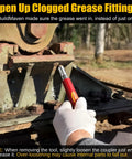 Gloved hand using Go To Grease Fitting Cleaning Tool Red That Cleans Zerk Fittings And Removes Dried Grease From Pins Shafts Bushings And Joints