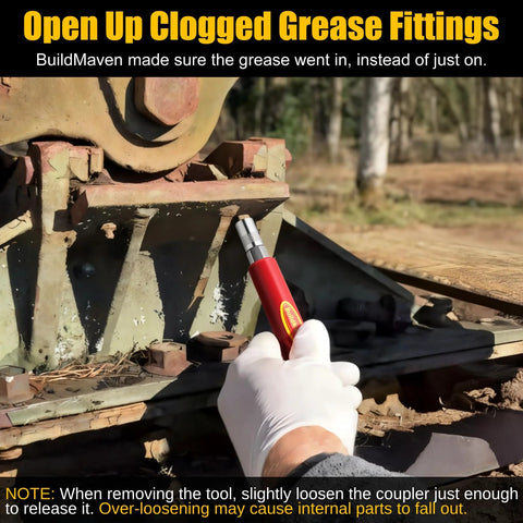 Gloved hand using Go To Grease Fitting Cleaning Tool Red That Cleans Zerk Fittings And Removes Dried Grease From Pins Shafts Bushings And Joints