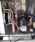 Refrigerator Filter Dryer With Access And Service Valve And Three In One HVAC Tool Kit installation in fridge, copper components visible.
