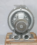 Efficient 2.8 HP regenerative blower delivers 221 CFM airflow with 64 inH2O vacuum and 60 inH2O pressure, front view on pallet
