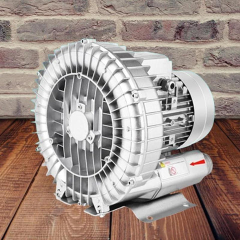 High-Pressure regenerative blower for industrial ventilation and wastewater aeration, shown in aluminum body on wooden surface.