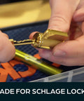 Hands rekeying a lock with the Ultimate Rekey Kit For Schlage Locks With 50 Master Pins And Seal Tight Box Lock Pinning Kit