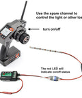 Remote Control AUX On Off Electronic Switch Relay setup shown with transmitter and LED light connection for cars and drones.