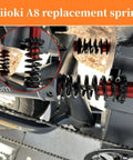 Close-up of installed black compression springs on machinery, focus on coil design and mounting.