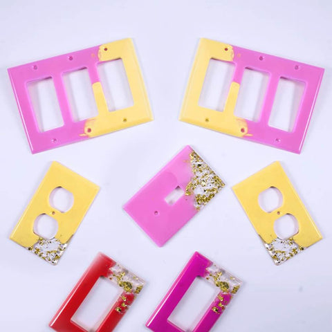 Colorful epoxy resin light switch and outlet covers made with 7 Piece Light Switch Cover Resin Molds Set for Epoxy Resin Crafts.