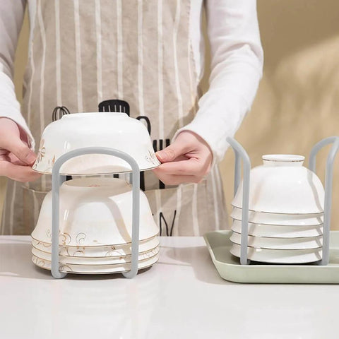 2 Pcs Bowl Rack for Kitchen Cutlery, Retractable Plastic Dish Rack, shown storing stacked bowls on a countertop