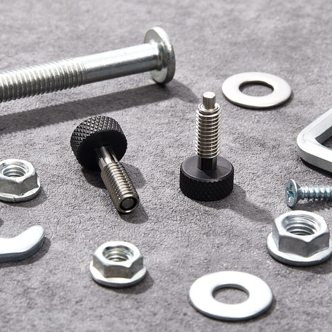 Hand Retractable Spring Plunger With Knurled Handle M6 Quick Release Pins and nuts on gray surface