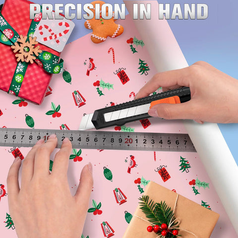 Four pack retractable utility knife with 18mm snap off blades cutting wrapping paper with ruler guide, in home workshop