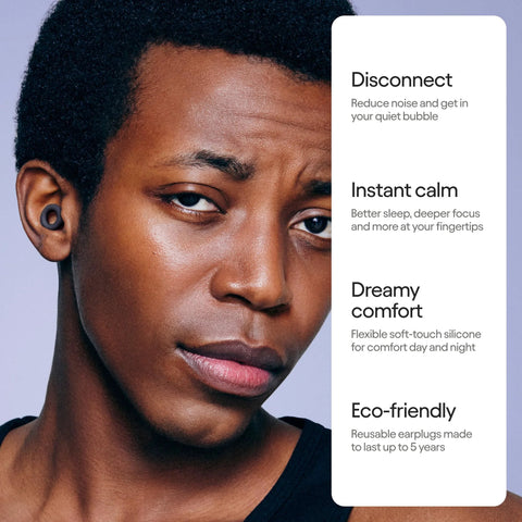 Close-up of a person wearing ultra comfortable reusable ear plugs with 24 decibel SNR noise reduction, flexible silicone fit visible.