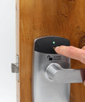 RFID Commercial Lever Door Lock With App Access Control And Includes 2 NFC Keycards Left Hand, installed on wooden door close-up.
