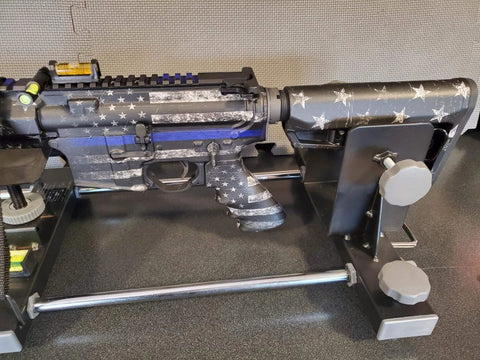Rifle with star pattern in mount using Four Pack Gunsmith Scope Leveling Bubble Tools With Magnetic Base For Optics Mounting And Rifle Alignment