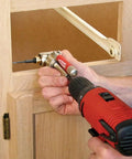 Person using One Quarter Inch 90 Degree Angle Offset Power Groove Drive Adapter 49-22-8510 for right angle drilling in cabinetry
