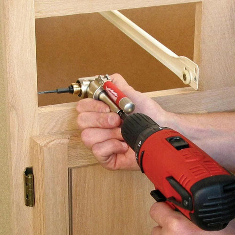 Person using One Quarter Inch 90 Degree Angle Offset Power Groove Drive Adapter 49-22-8510 for right angle drilling in cabinetry