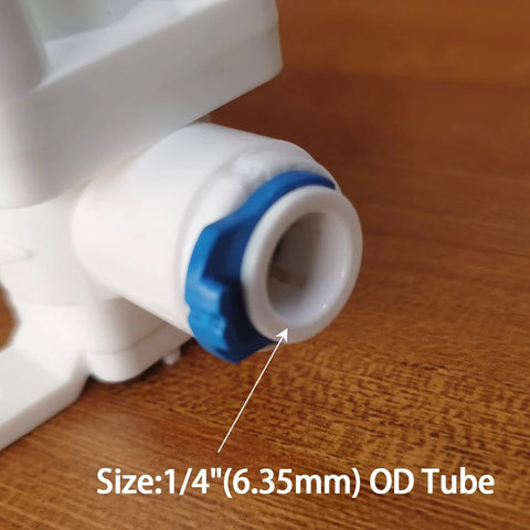 Close-up of RO system pressure relief regulator with 1/4 inch OD tube fitting.