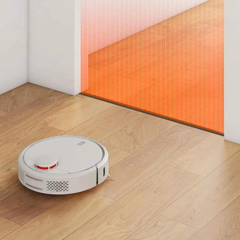 Robot vacuum near magnetic boundary strips for robotic vacuum cleaners, 13 feet of tape markers to create no go zones for older models.