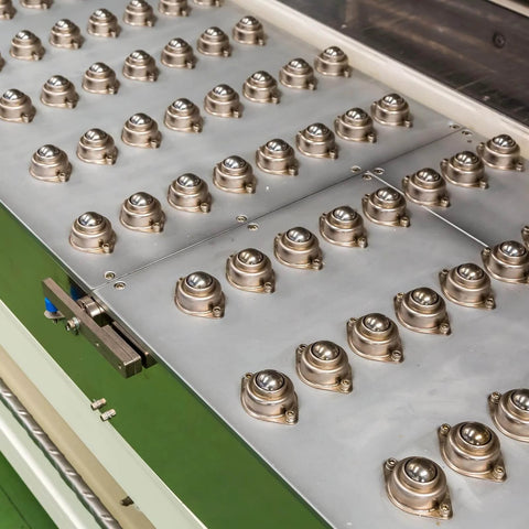 Conveyor setup with 5/8 Inch Roller Ball Transfer Bearings 8 Pcs Nylon and Carbon Steel Round Ball Units for smooth 360 degree rotation.