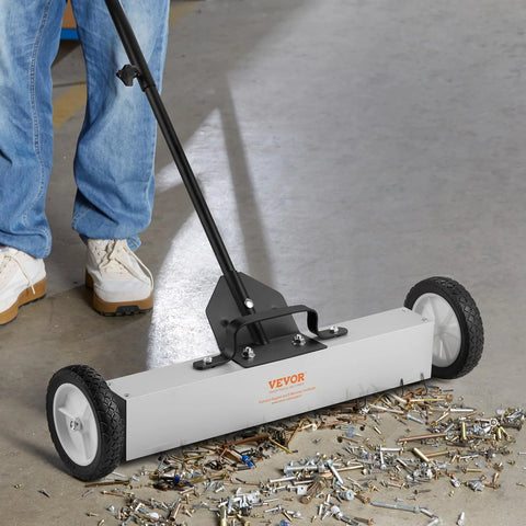 Effortless, heavy duty rolling magnetic sweeper with a 24 inch wide magnet and 50 lb pickup capacity, removing debris on floor