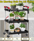 Utility cart with plants on tiered shelves showing swivel casters, suitable for wood, carpet, tile, cement, and concrete floors.