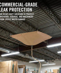 Commercial-grade roof leak protection system installed in warehouse with drainage system to divert leaks and protect inventory.