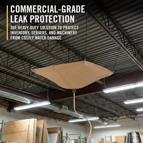 Commercial-grade roof leak protection system installed in warehouse with drainage system to divert leaks and protect inventory.
