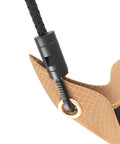 Close-up view of a Heavy Duty Roof Leak Diverter Tarp Kit 5x5 Ft Waterproof Ceiling Rain Catcher With Drainage System, showing grommet and strap.