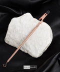 Bracelet Fastener Helper Tool With Hook For Bracelet Necklace Jewelry And Watch Clasp Clip, rose finish, on black fabric.