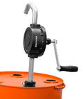 Side view of Groz 44080 Rotary Fuel Pump with Steel Discharge Spout mounted on an orange barrel, showing the handle and spout.