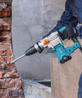 Worker using Heavy Duty SDS Max Rotary Hammer Drill With Vibration Control And Safety Clutch 13 Amp Motor for concrete breaking