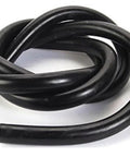 Coiled black rubber hose for ultra quiet rotary vane vacuum pump for brake boosters, compatible with turbo and big cam engines.