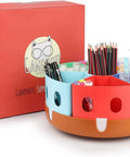Rotating Art Supplies Organizer With 360 Spin Base And Large Removable Caddy for desk use with seven colorful compartments filled with stationery.