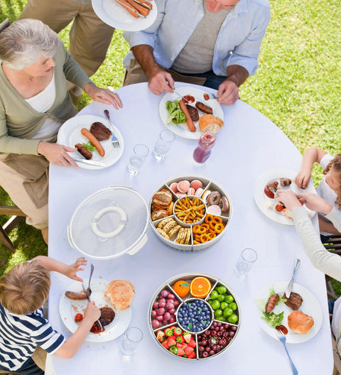 Family picnic using Divided Rotating Serving Tray With Lid And Handle 12 Inch Clear Lazy Susan Organizer for snacks and fruits.