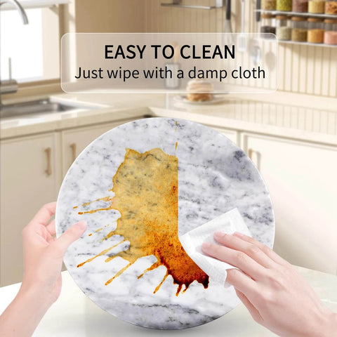 Person cleaning a 12 inch marble lazy susan turntable made from natural marble, showcasing its easy-to-clean surface.