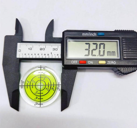 Digital caliper measuring 32mm circular yellow green spirit level from Six Piece Round Bubble Level Set Handy Pro Grade High Quality Circular Spirit Levels 32mm Diameter 7mm Height Yellow Green Color With Degree Markings For Precise Layout And Measuring For Woodworking And Construction