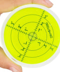Hand holding Magnetic Round Bubble Level Tool Pro Grade Bullseye Inclinometer for Machinists, 60mm with clear markings