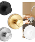 Set of black, gold, silver, and white round kitchen drain plugs with hand washing one under tap