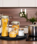 Round Wooden Bathroom Tray With 360 Degree Silent Rotation Lazy Susan Turntable on kitchen counter with jars and pot