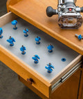 Router Bit Storage Inserts Set For 1/4 And 1/2 Inch Shank Router Bits in wooden drawer, durable molded polyethylene organizer.