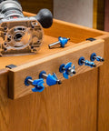 Router Bit Storage Inserts Set For 1/4 And 1/2 Inch Shank Router Bits in wooden bench storage with router and bits displayed.