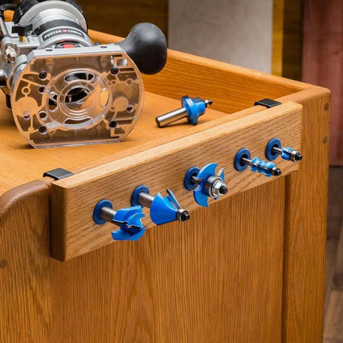 Router Bit Storage Inserts Set For 1/4 And 1/2 Inch Shank Router Bits in wooden bench storage with router and bits displayed.